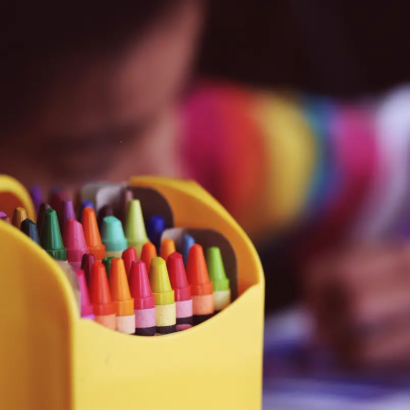 Box of multicolored crayon